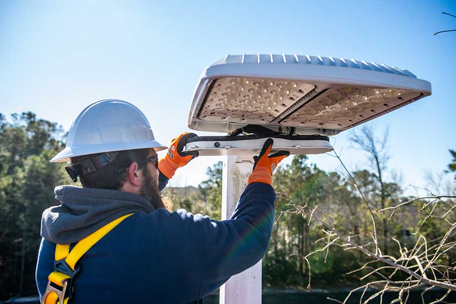 Commercial electrician performing electrical services