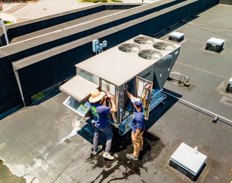 Technicians providing commercial HVAC services