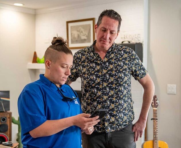 Technician providing home care guidance