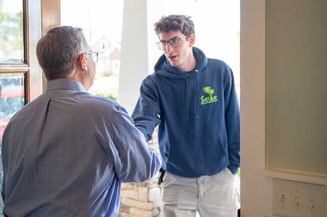 Salt Air employee talking with client